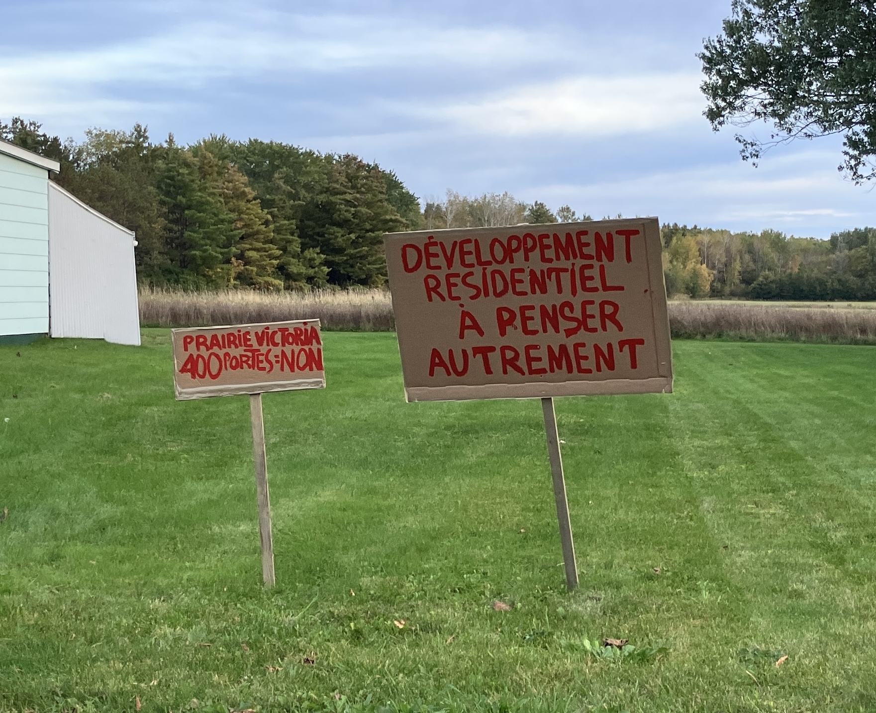 Citizen signs near a wooded area
